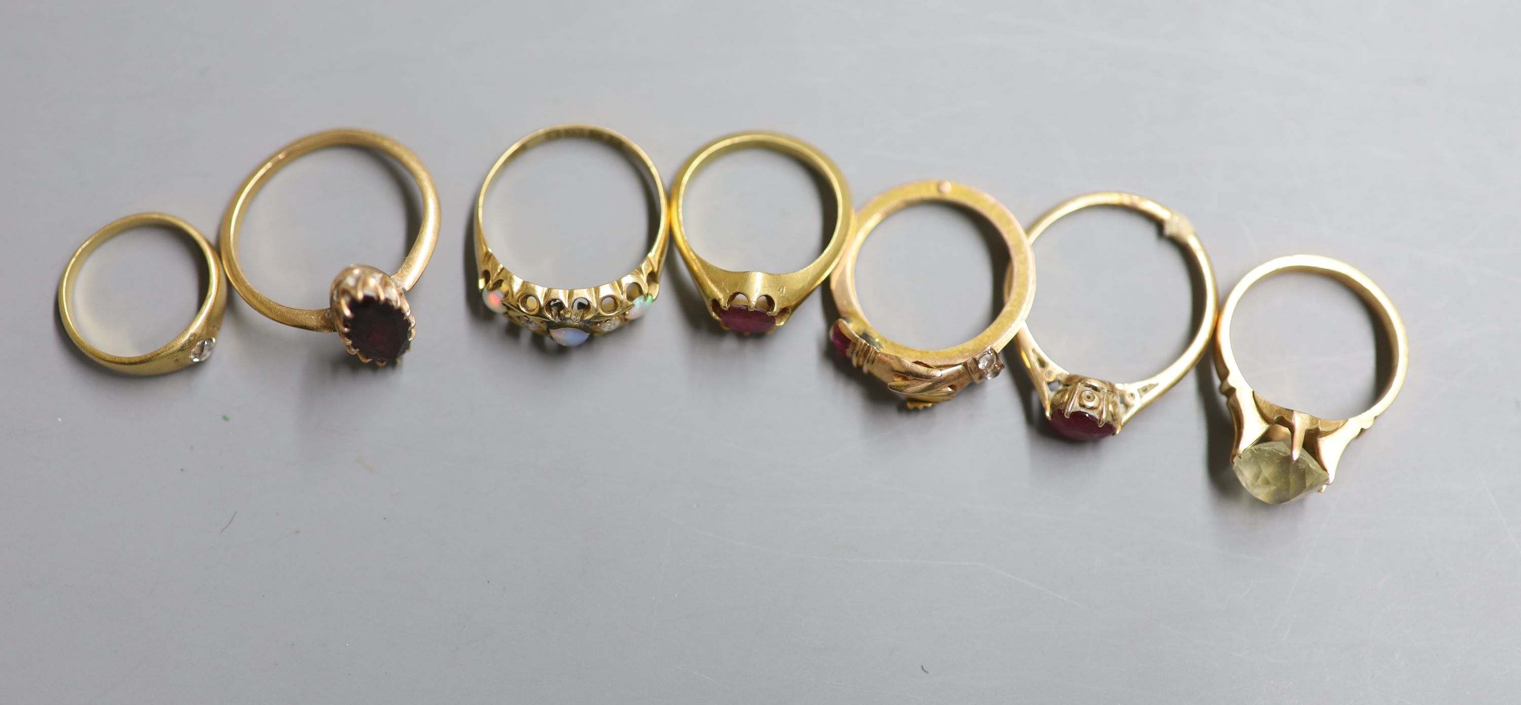 Seven assorted rings.